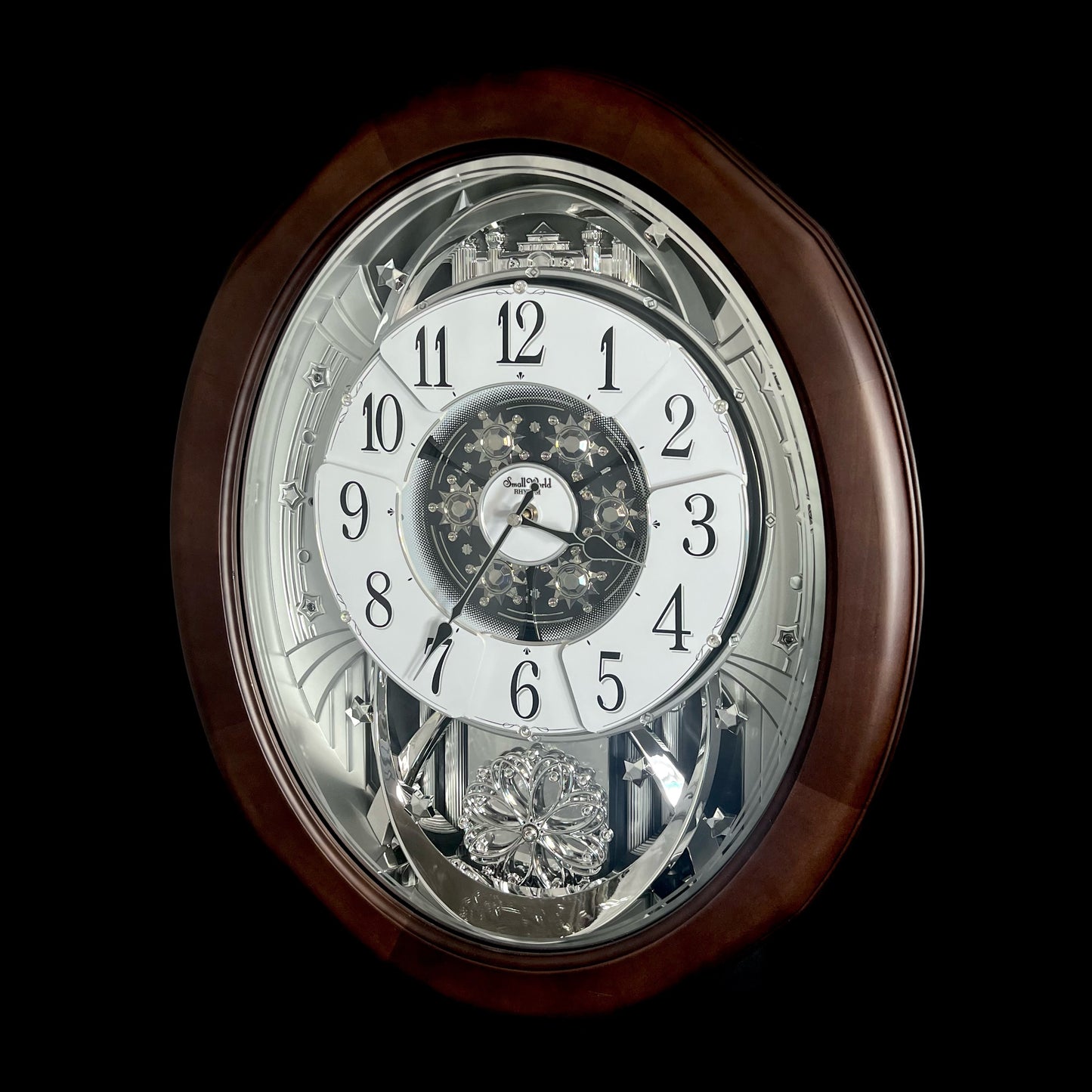 Rhythm "Anthology Espresso" Magic Motion Musical Wooden Wall Clock with Moving Dial - 4MH869WU06