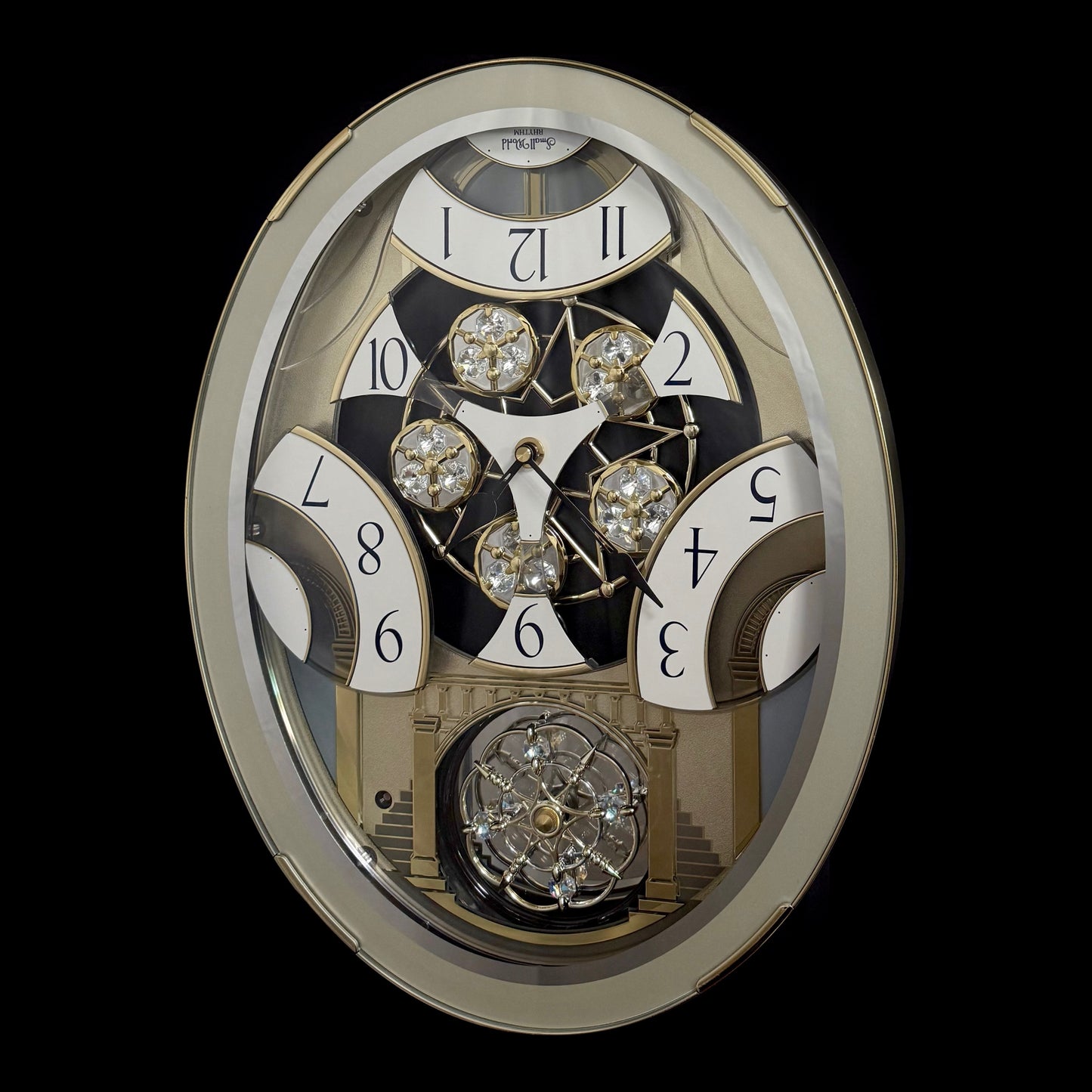 Rhythm "CTS Brilliance" Moving Dial Magic Motion Musical Wall Clock with Popular Melodies - 4MH787-R18