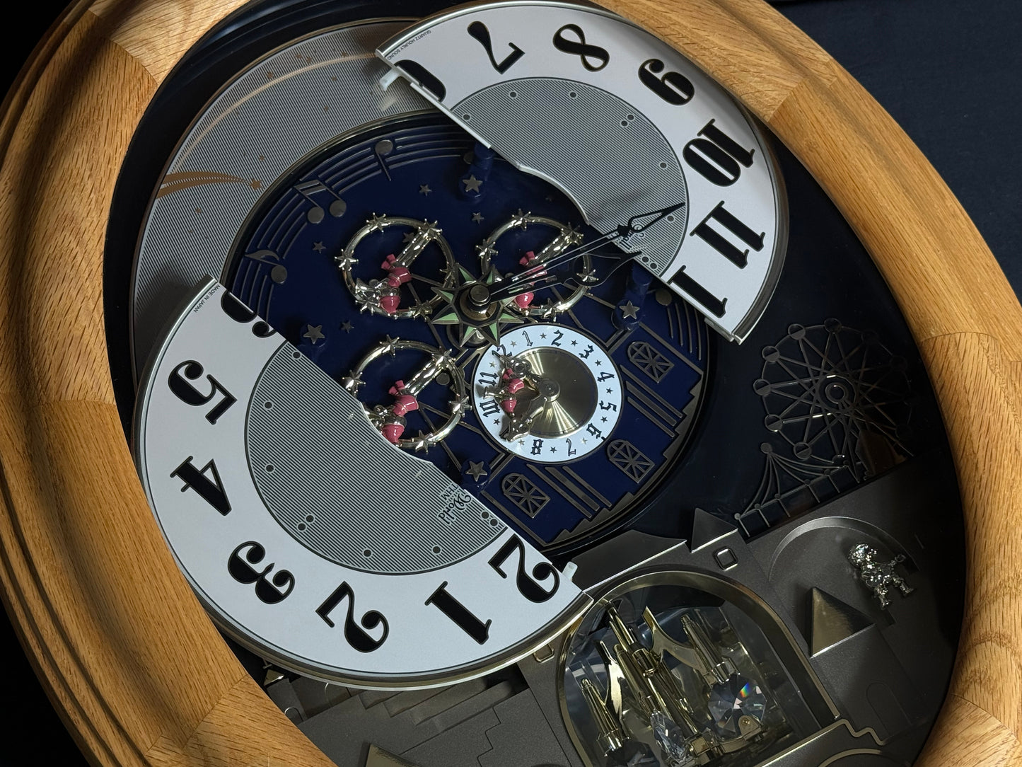 Rhythm "DWS Timecracker Oak" Moving Dial Magic Motion Musical Wooden Wall Clock with Popular Melodies - 4MH777-R07