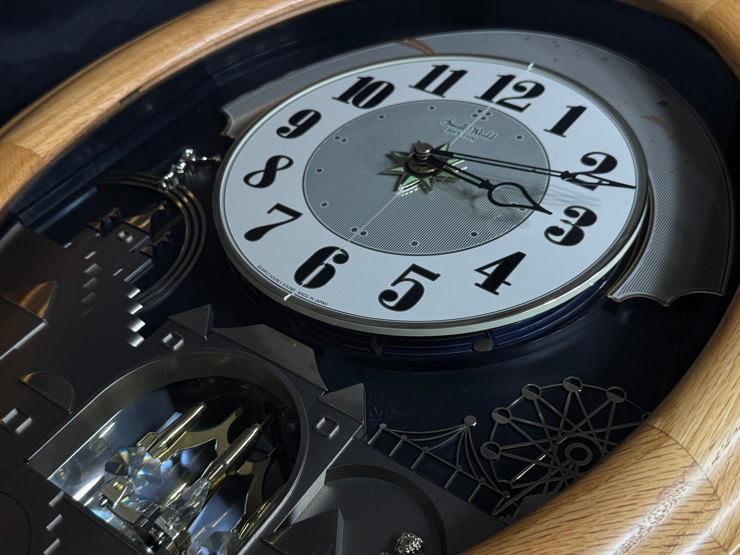 Rhythm "DWS Timecracker Oak" Moving Dial Magic Motion Musical Wooden Wall Clock with Popular Melodies - 4MH777-R07