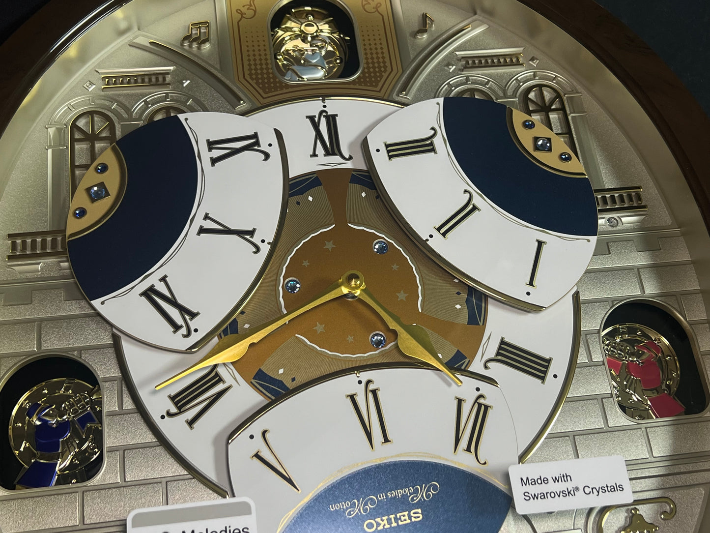 Seiko QXM371BRH “Castle Windows” Melodies in Motion Dancing Dial Musical Wall Clock