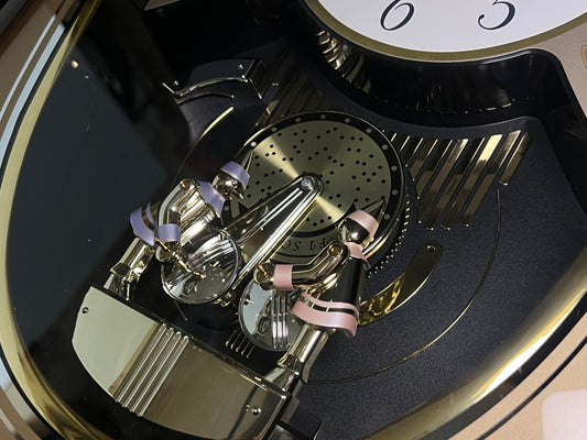 Seiko QXM124GRH "Music Disc Figurines" Melodies in Motion Musical Moving Wall Clock with Popular Music