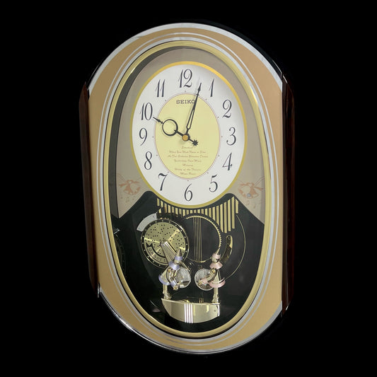 Seiko QXM124GRH "Music Disc Figurines" Melodies in Motion Musical Moving Wall Clock with Popular Music