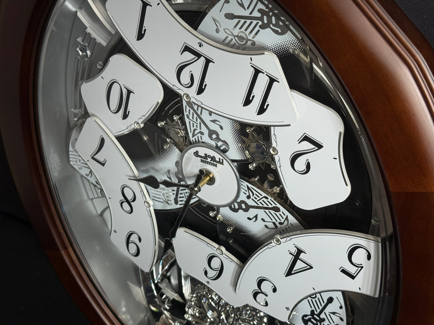 Rhythm "Anthology Espresso" Magic Motion Musical Wooden Wall Clock with Moving Dial - 4MH869WU06
