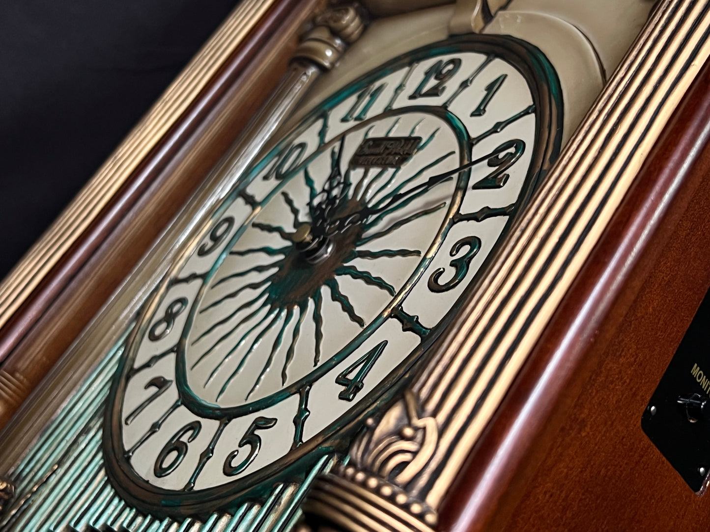 Rhythm “CTS Sundial” Gothic Wooden Musical Motion Pendulum Wall Clock with Popular Melodies - CMJ336UR06