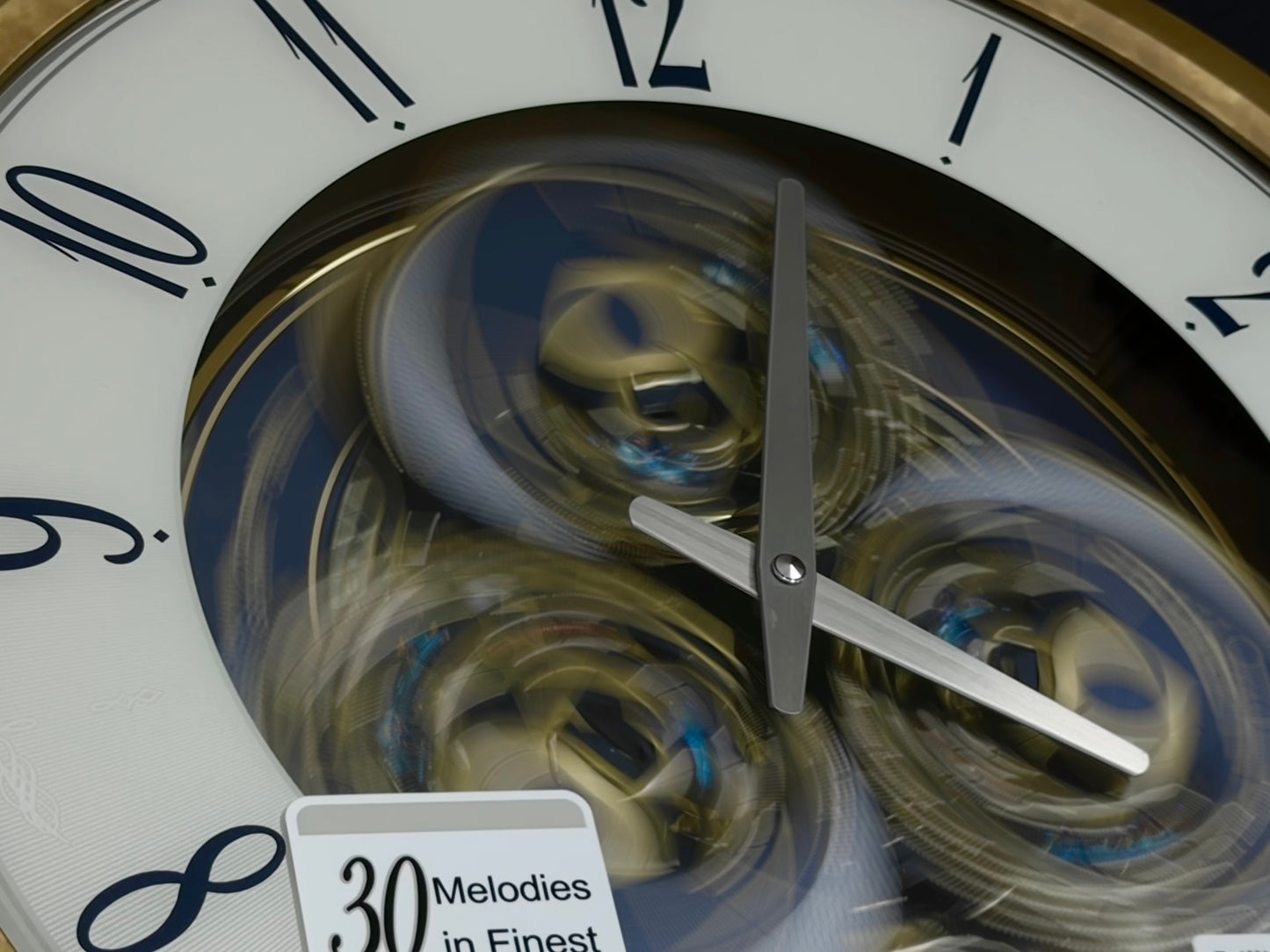 Seiko QXM387GRH “Kingly Mechanical” Melodies in Motion Dancing Dial Musical Wall Clock with 30 Songs