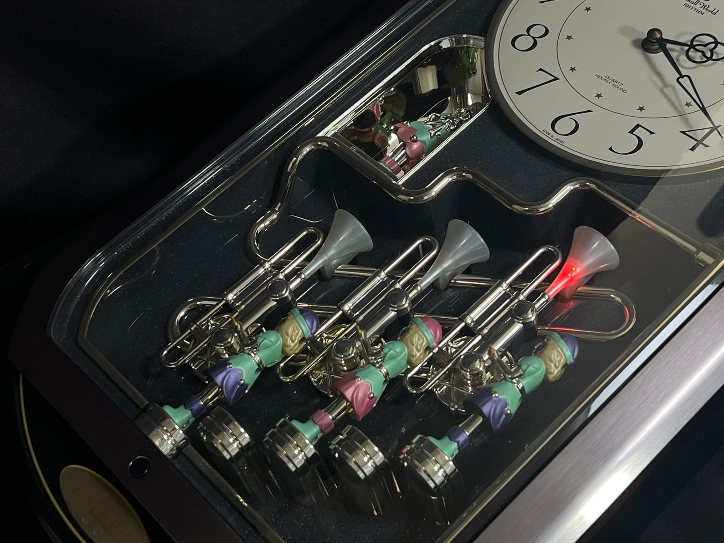 Rhythm "Trumpet Trio" Magic Motion Musical Wall Clock with Animated Figurines - 4MH712-R02