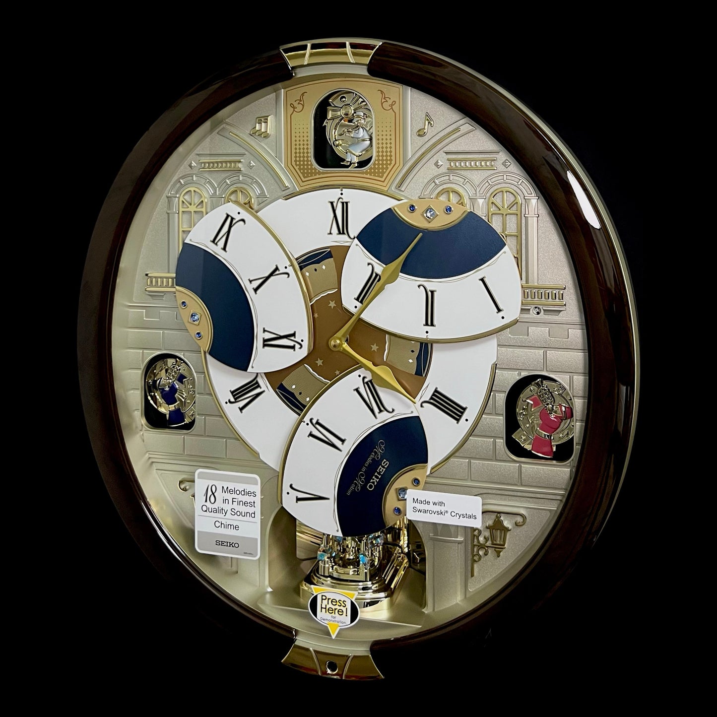 Seiko QXM371BRH “Castle Windows” Melodies in Motion Dancing Dial Musical Wall Clock