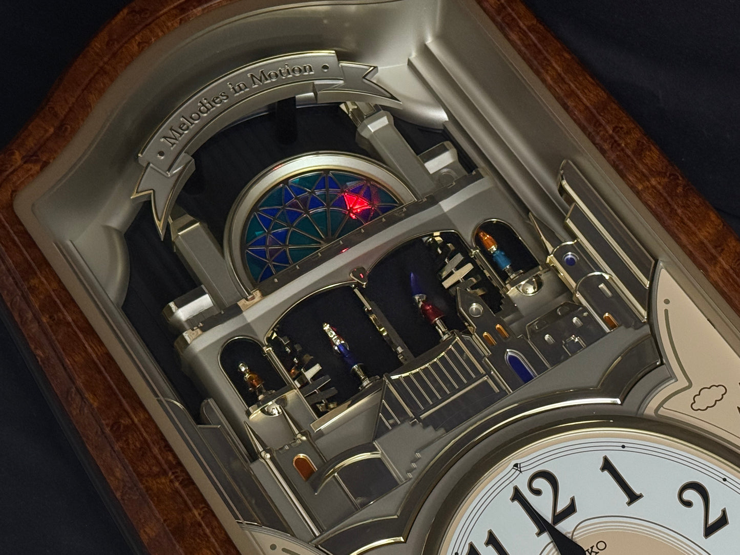 Seiko QXM135BRH "Lover’s Castle" Melodies in Motion Musical Moving Wall Clock with Popular Melodies