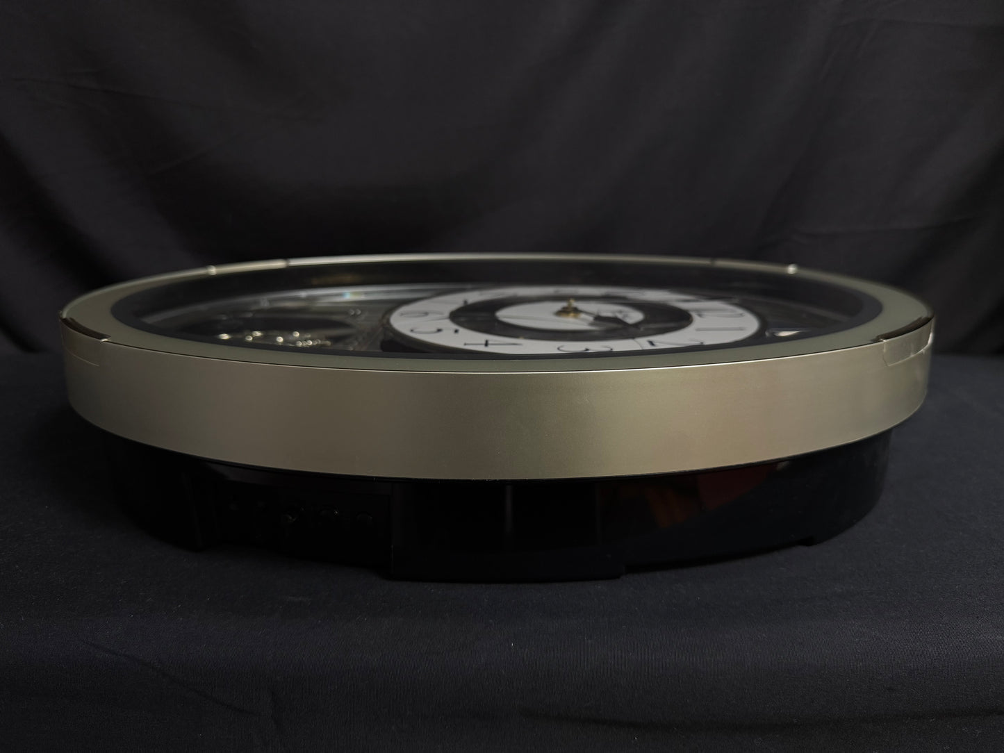 Rhythm "CTS Brilliance" Moving Dial Magic Motion Musical Wall Clock with Popular Melodies - 4MH787-R18