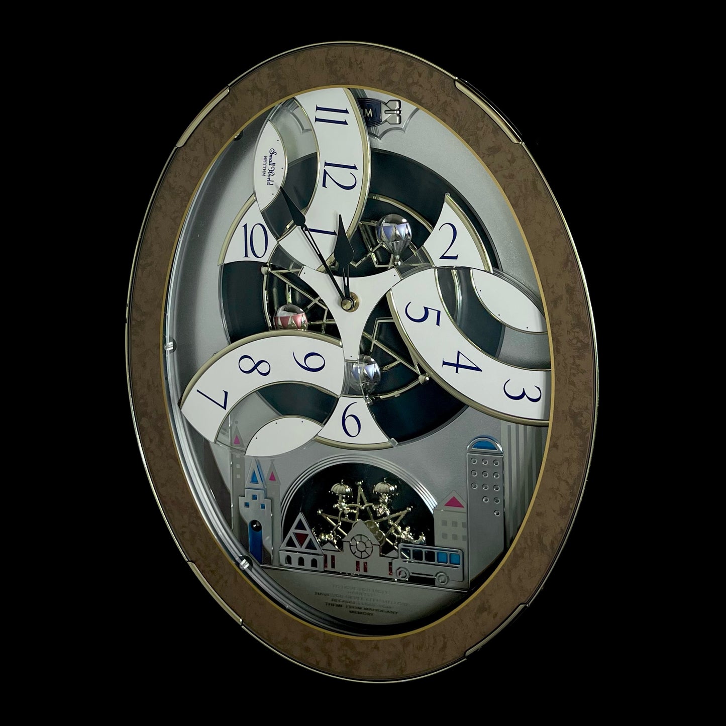 Rhythm “Tri-Cracker” Magic Motion Musical Wall Clock with Moving Dial and Balloons - 4MH759NR06
