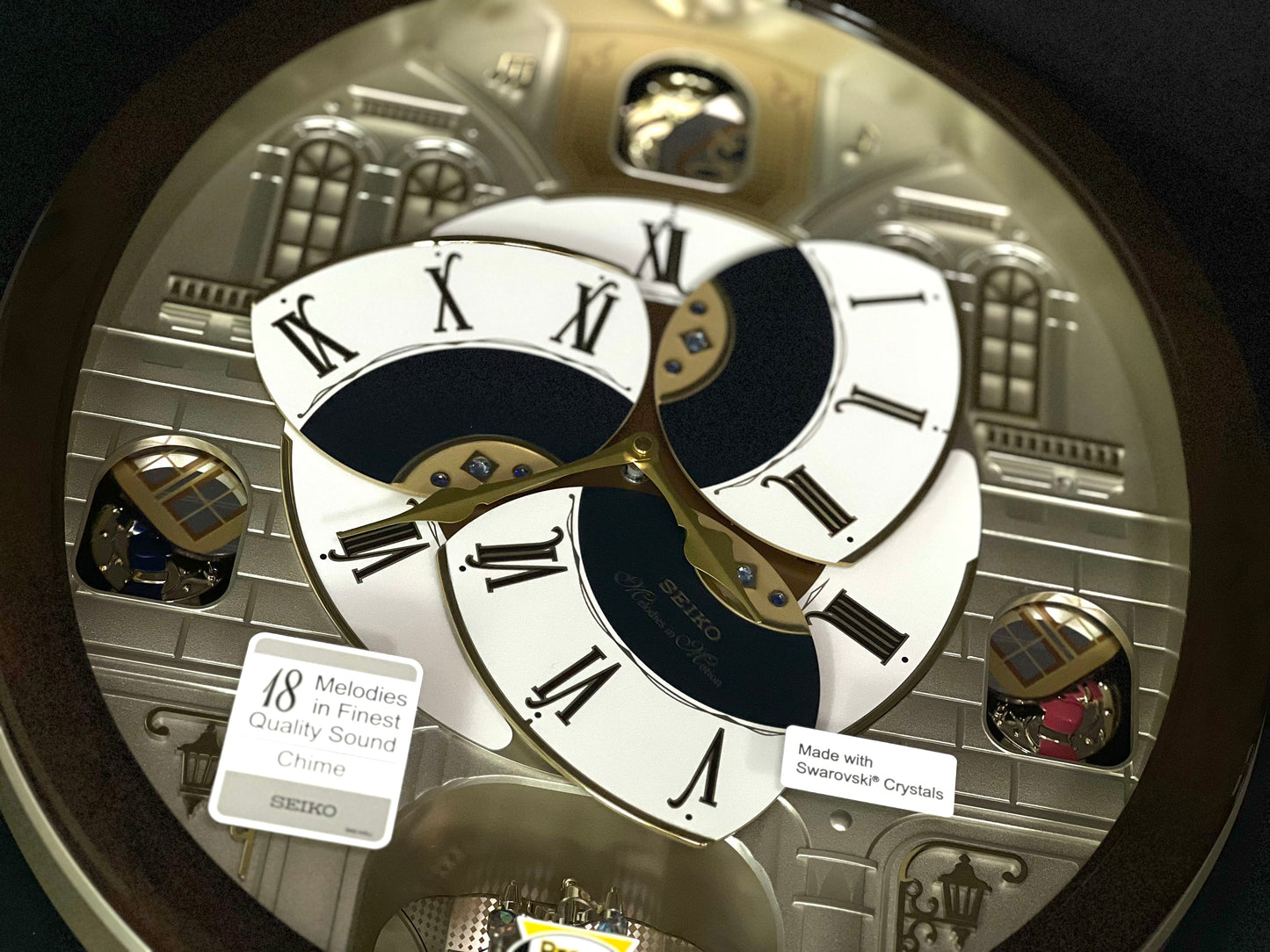 Seiko QXM371BRH “Castle Windows” Melodies in Motion Dancing Dial Musical Wall Clock
