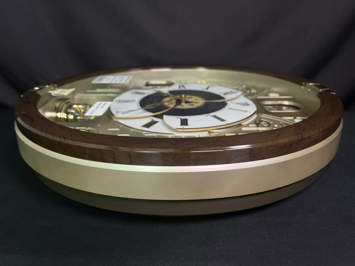 Seiko QXM371BRH “Castle Windows” Melodies in Motion Dancing Dial Musical Wall Clock