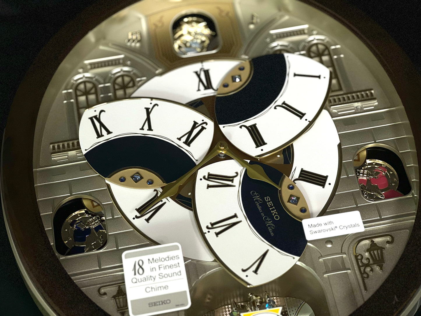 Seiko QXM371BRH “Castle Windows” Melodies in Motion Dancing Dial Musical Wall Clock