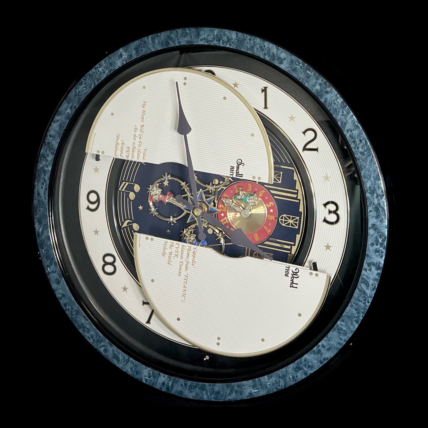 Rhythm “Small World Partage Home (Blue)” Moving Dial Magic Motion Musical Wall Clock with Popular Melodies - 4MH754RH04