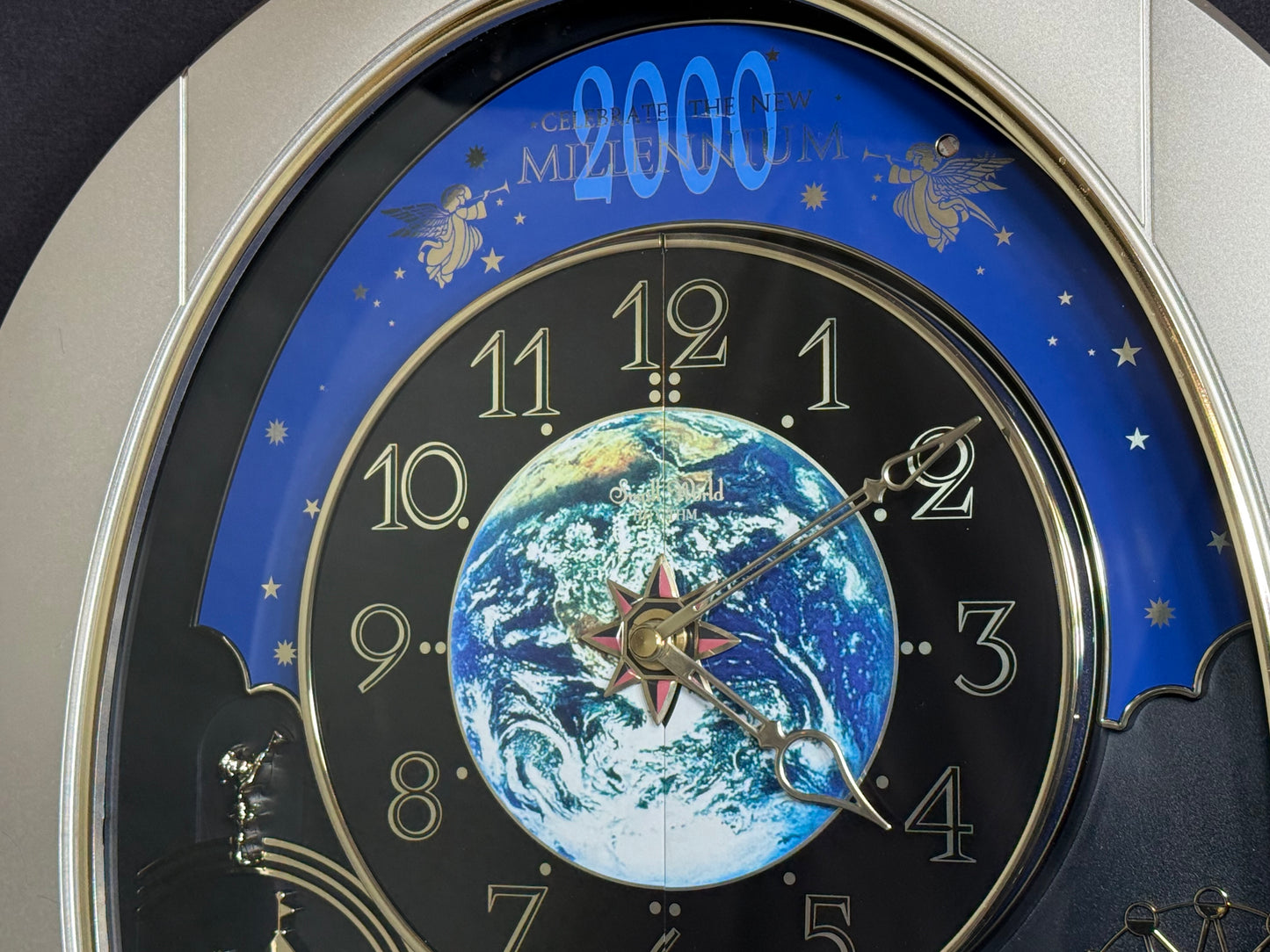 Rhythm “Timecracker 2000” Limited Edition Moving Earth Dial Magic Motion Musical Wall Clock with Popular Melodies - 4MH751NR19