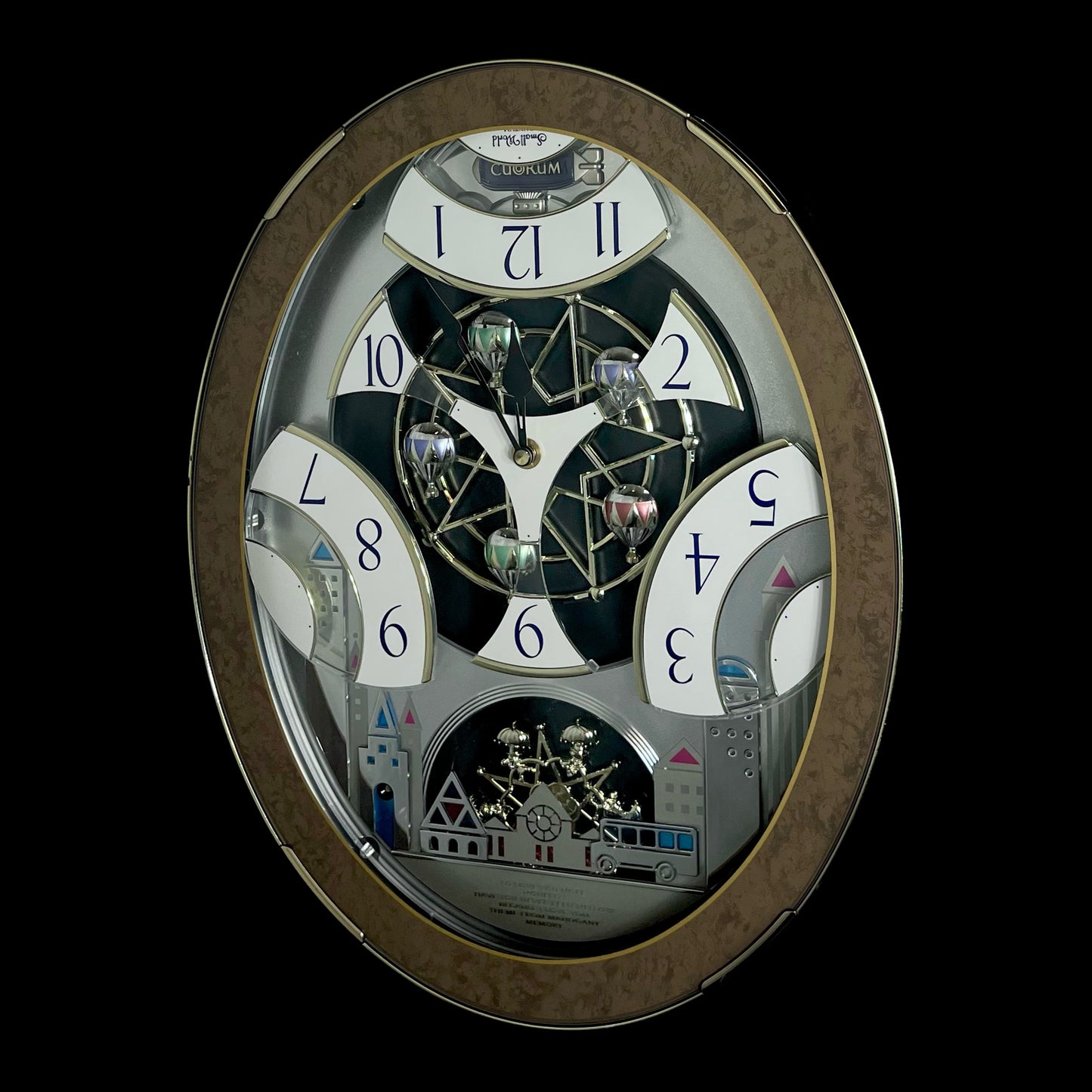 Rhythm “Tri-Cracker” Magic Motion Musical Wall Clock with Moving Dial and Balloons - 4MH759NR06