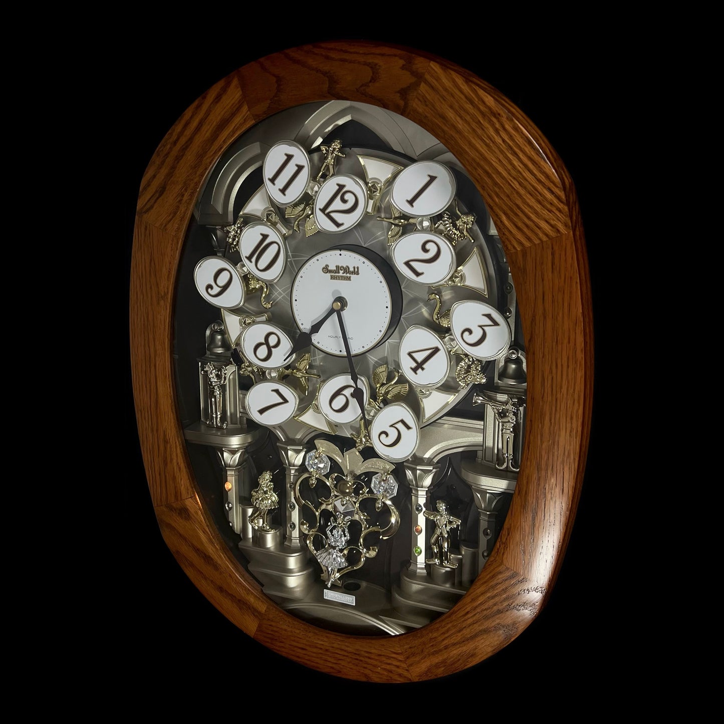 Rhythm "SSS Encore" Magic Motion Musical Wooden Wall Clock with Animated Moving Dial and Popular Melodies - 4MH810-R06