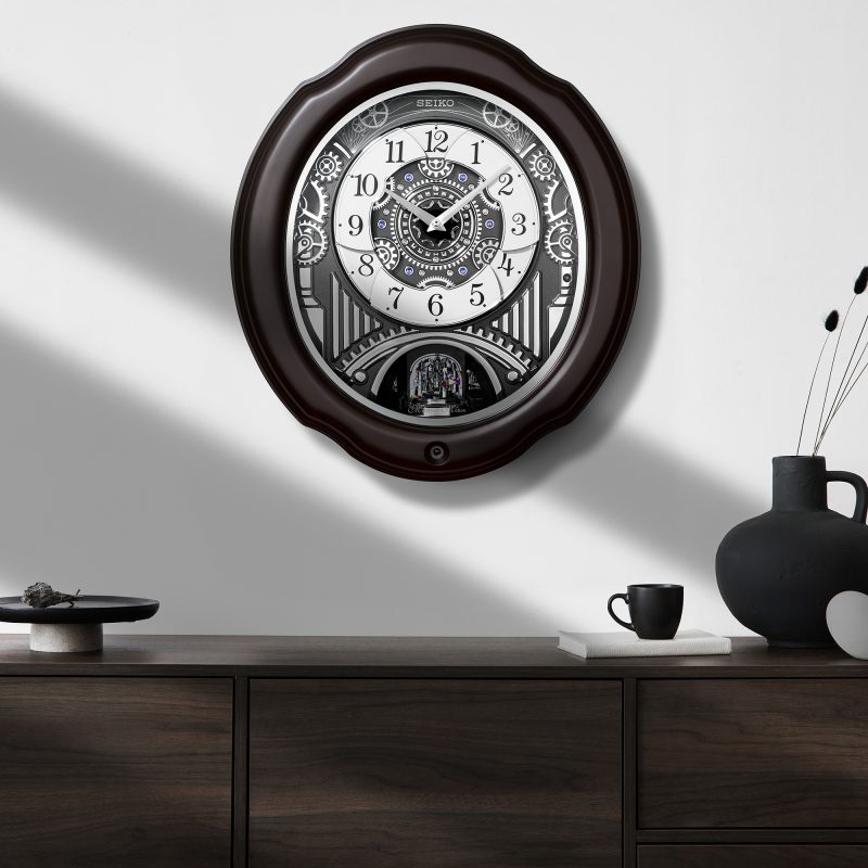 Seiko QXM609NRH “Opera” Melodies in Motion Dancing Dial Musical Wooden Wall Clock with 36 Songs