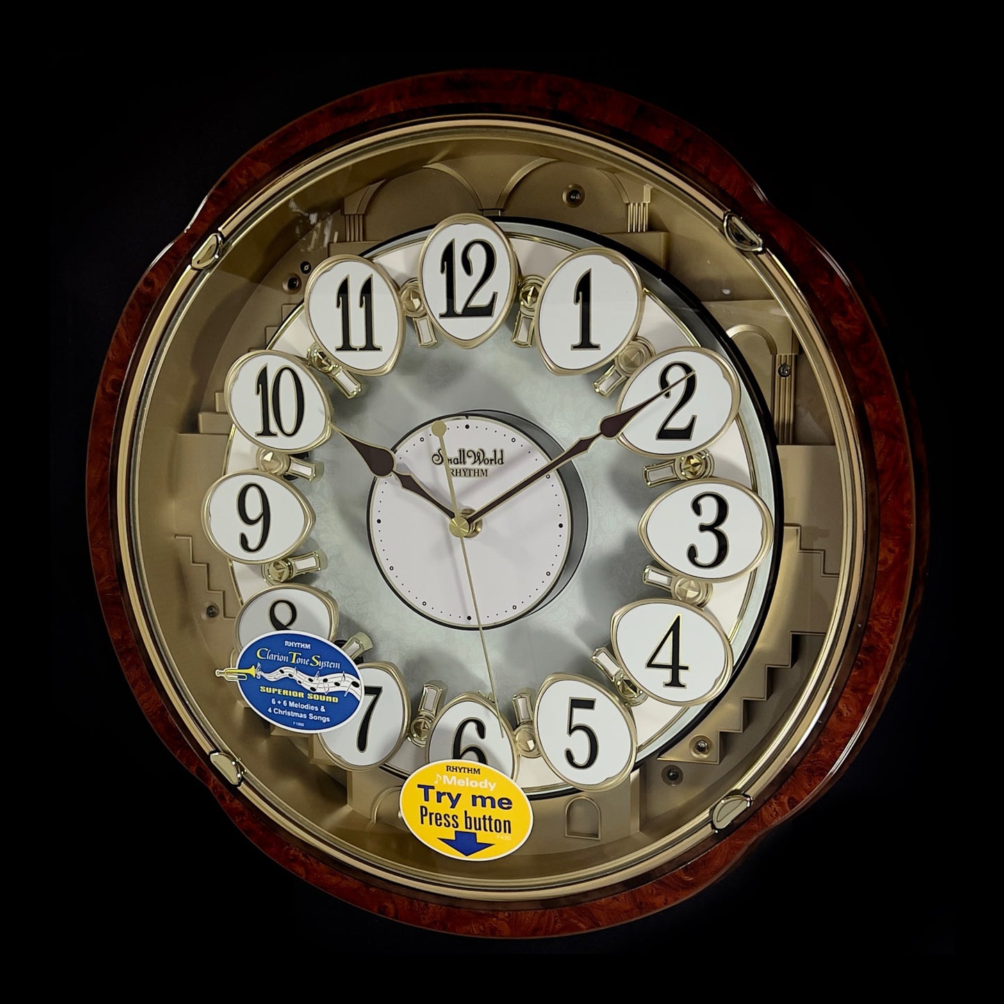 Rhythm “Woodgrain Blossom” Magic Motion Musical Wall Clock with Animated Moving Dial - 4MH828WD23