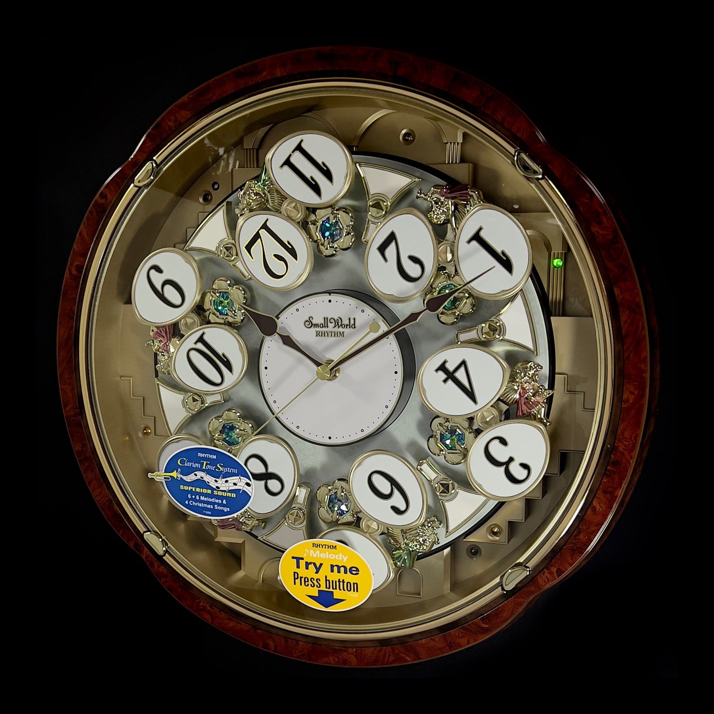 Rhythm “Woodgrain Blossom” Magic Motion Musical Wall Clock with Animated Moving Dial - 4MH828WD23