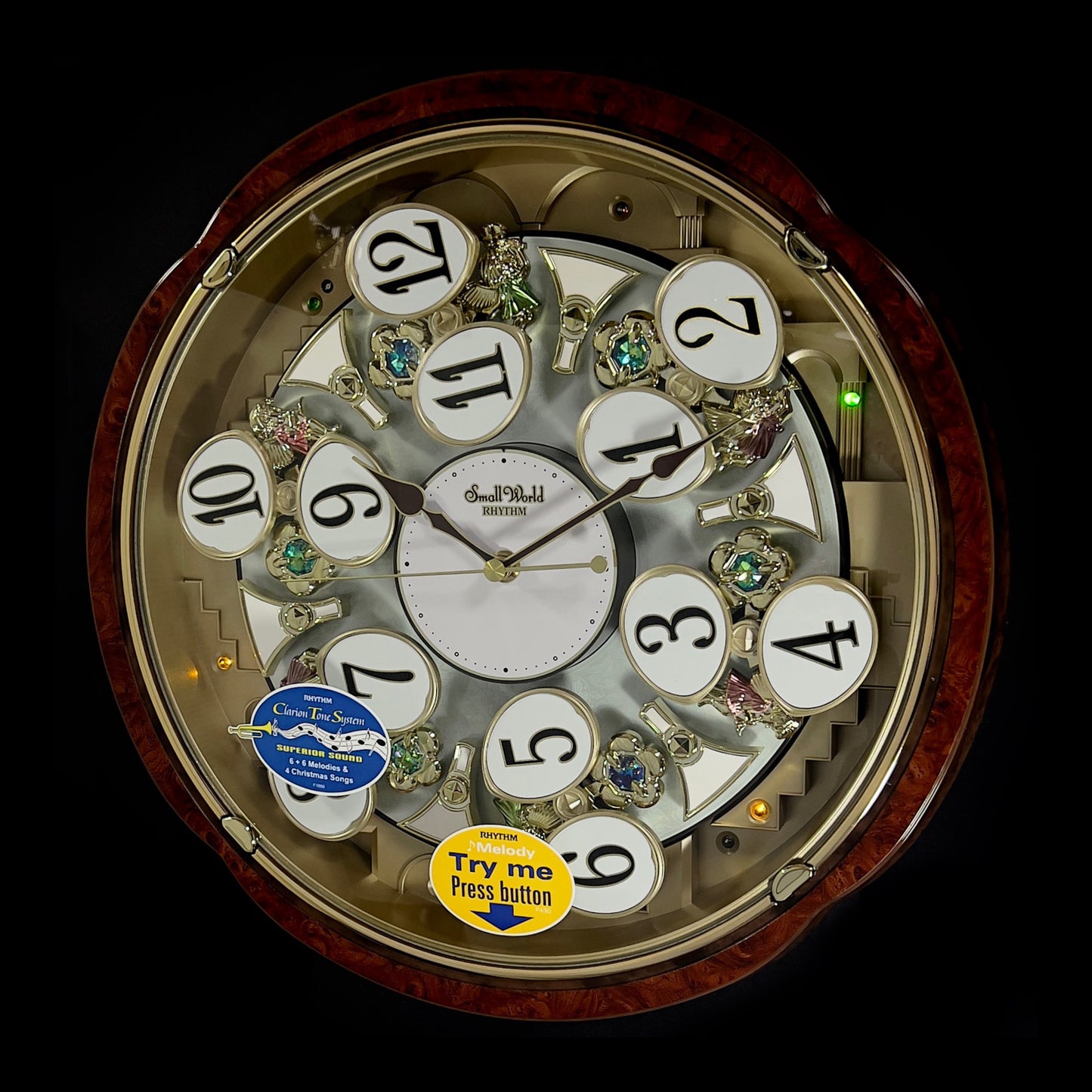 Rhythm “Woodgrain Blossom” Magic Motion Musical Wall Clock with Animated Moving Dial - 4MH828WD23