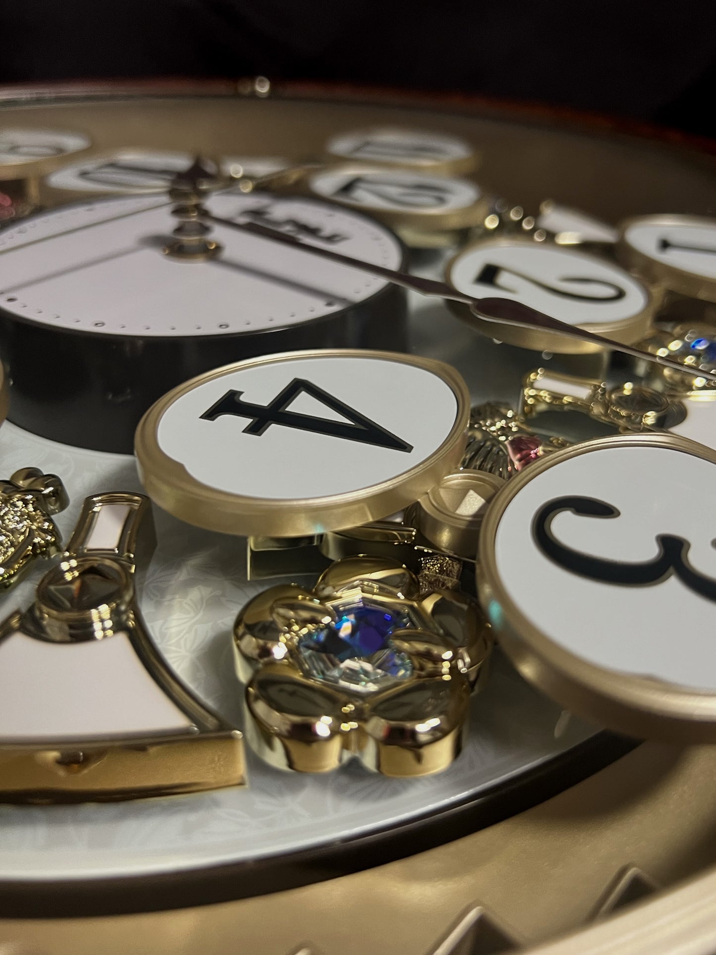 Rhythm “Woodgrain Blossom” Magic Motion Musical Wall Clock with Animated Moving Dial - 4MH828WD23