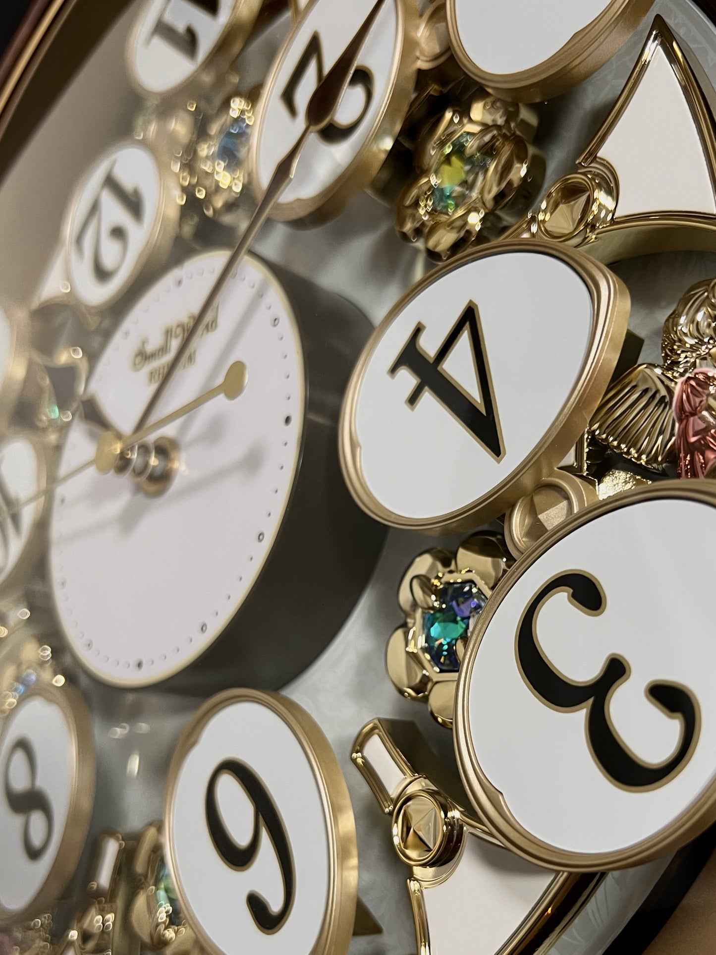 Rhythm “Woodgrain Blossom” Magic Motion Musical Wall Clock with Animated Moving Dial - 4MH828WD23