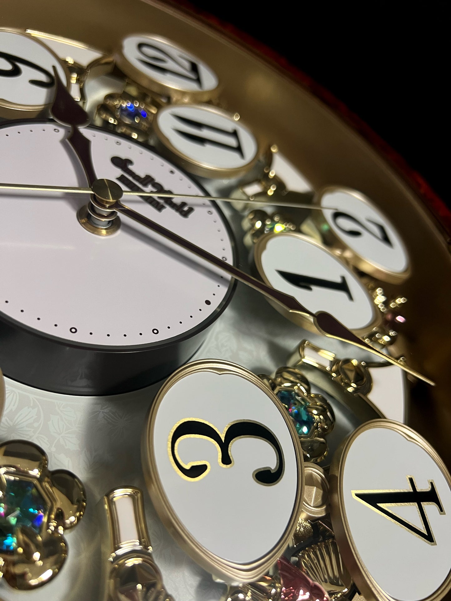 Rhythm “Woodgrain Blossom” Magic Motion Musical Wall Clock with Animated Moving Dial - 4MH828WD23