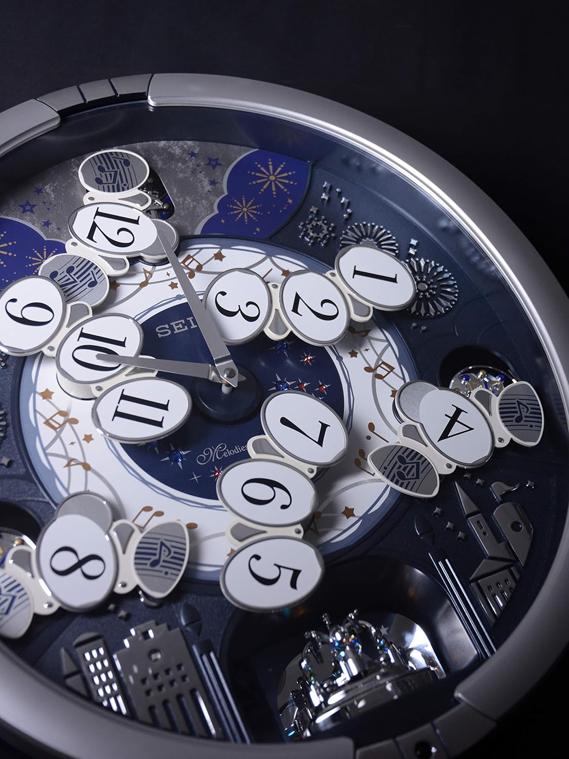 Seiko QXM379SRH “Glittering Starry Night” Melodies in Motion Dancing Dial Musical Wall Clock