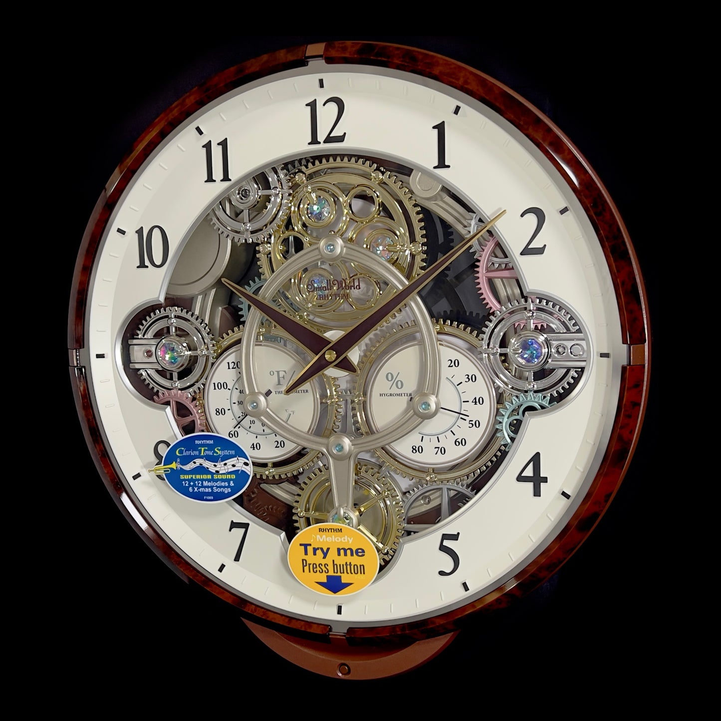 Rhythm “Widget (Woodgrain)” Skeletonized Dial Magic Motion Musical Wall Clock with Moving Gears - 4MH886WU23