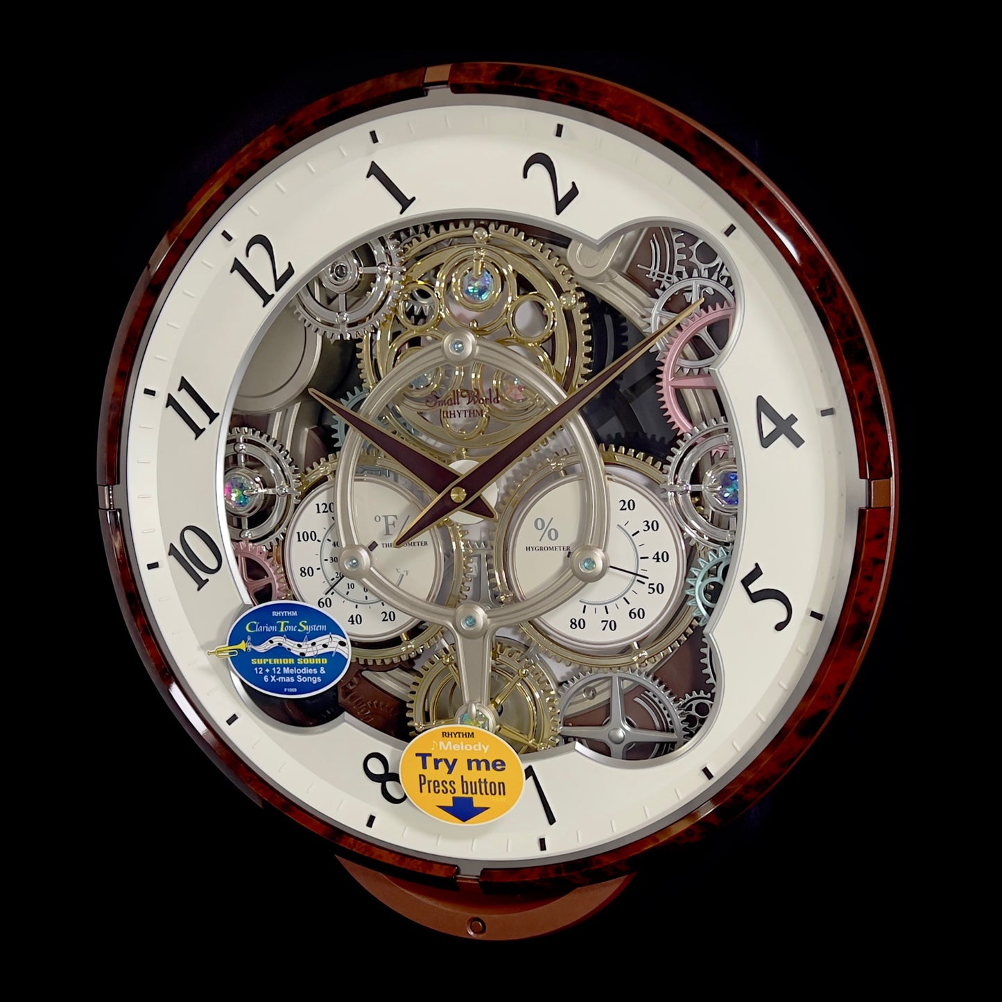 Rhythm “Widget (Woodgrain)” Skeletonized Dial Magic Motion Musical Wall Clock with Moving Gears - 4MH886WU23