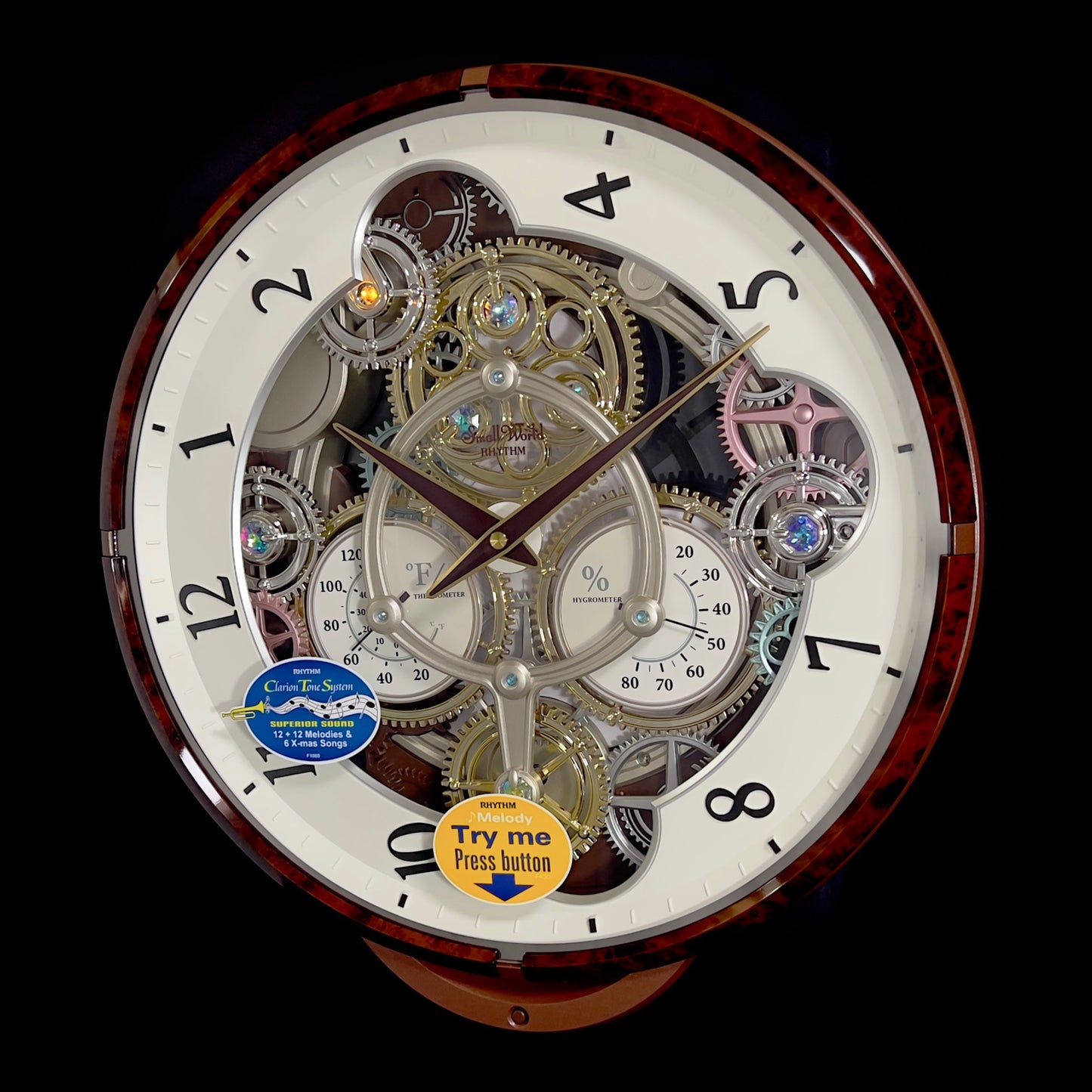 Rhythm “Widget (Woodgrain)” Skeletonized Dial Magic Motion Musical Wall Clock with Moving Gears - 4MH886WU23