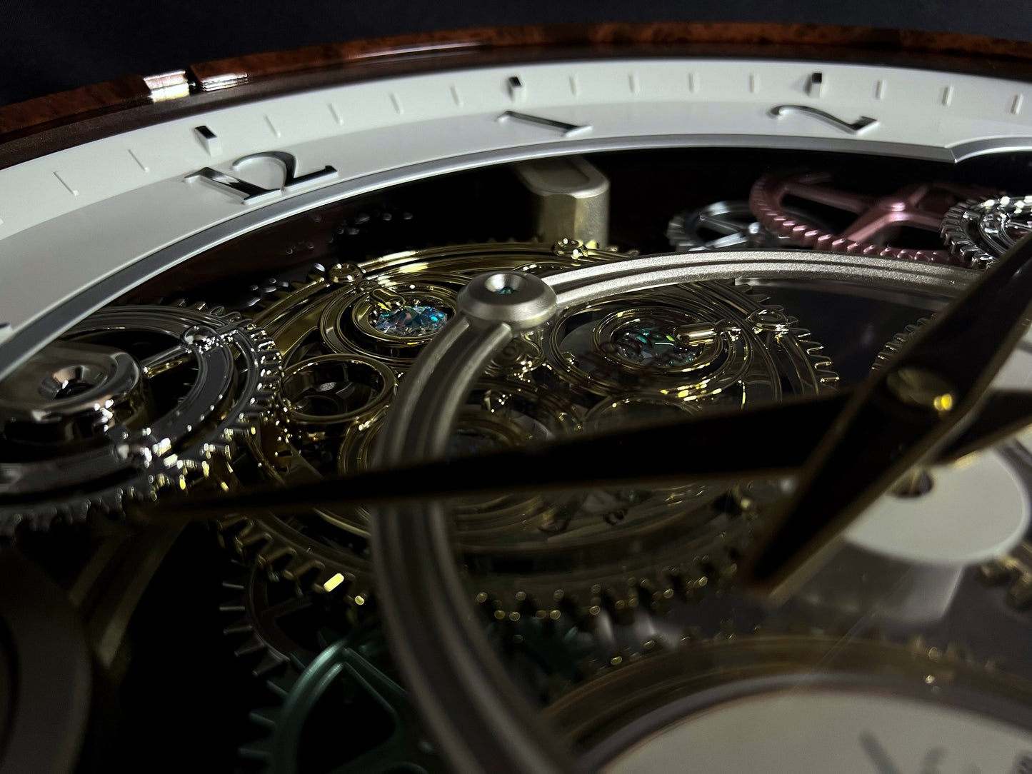 Rhythm “Widget (Woodgrain)” Skeletonized Dial Magic Motion Musical Wall Clock with Moving Gears - 4MH886WU23