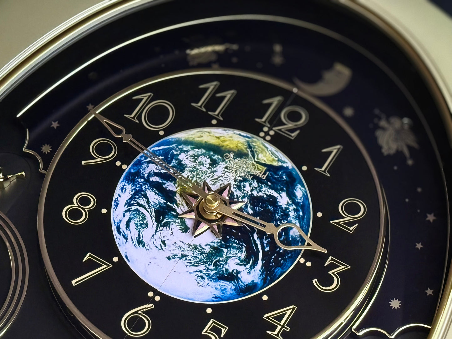 Rhythm “Peaceful Cosmos Entertainer” Moving Earth Dial Magic Motion Musical Wall Clock with Popular Melodies - 4MH839WB19