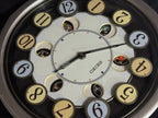 Seiko QXM106SRH "Twirling Numbers" Melodies in Motion Musical Wall Clock with Moving Dial