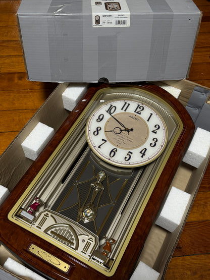 Seiko QXM123BRH "Broadway Showtunes Dropping Dial" Melodies in Motion Musical Moving Wall Clock with Popular Melodies