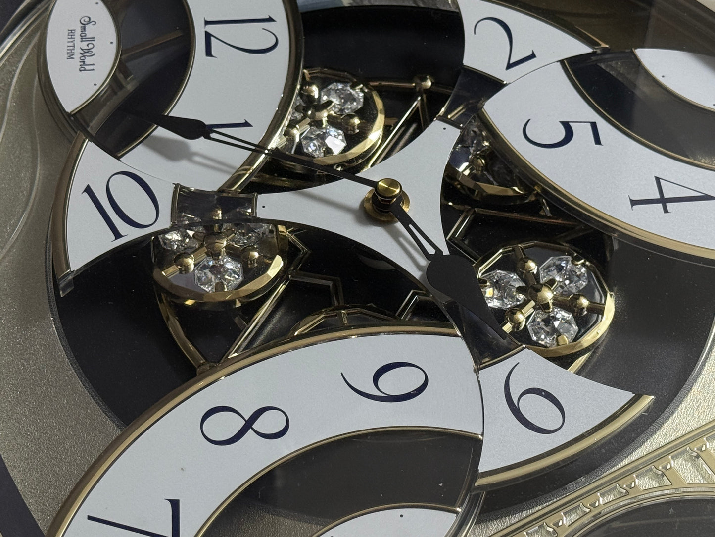 Rhythm "Classic Brilliance" Moving Dial Magic Motion Musical Wall Clock - 4MH787PD18