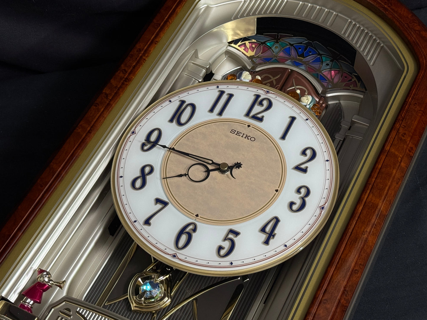 Seiko QXM223BRH "Classic Dropping Dial" Melodies in Motion Musical Moving Wall Clock