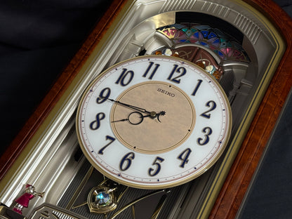 Seiko QXM223BRH "Classic Dropping Dial" Melodies in Motion Musical Moving Wall Clock