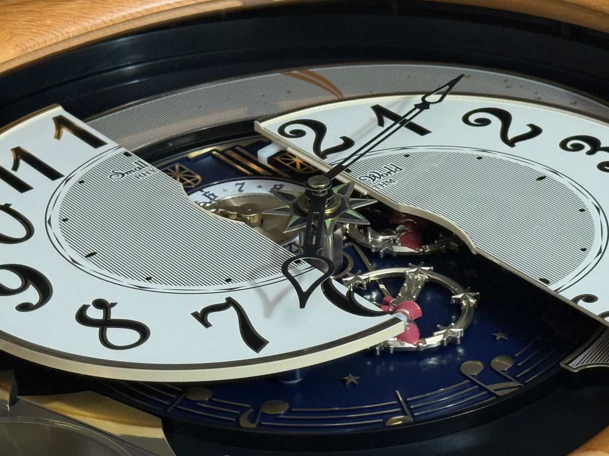 Rhythm "Timecracker Golden Oak" Moving Dial Magic Motion Musical Wooden Wall Clock with Popular Melodies - 4MH782-R07