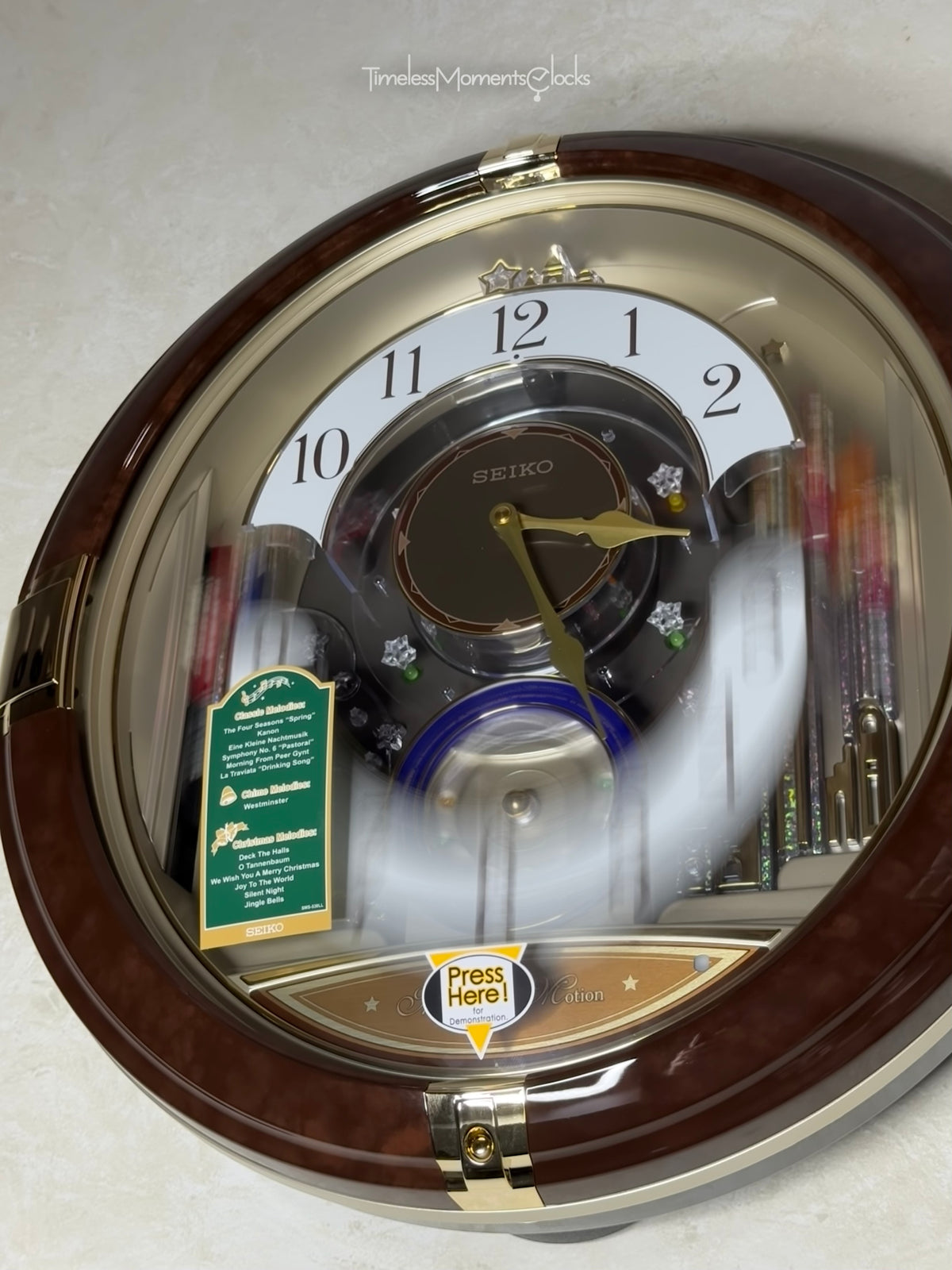 Seiko QXM333BRH "Trumpeting Angels" Melodies in Motion Jaw-Dropping Dial Musical Moving Wall Clock with 13 Songs