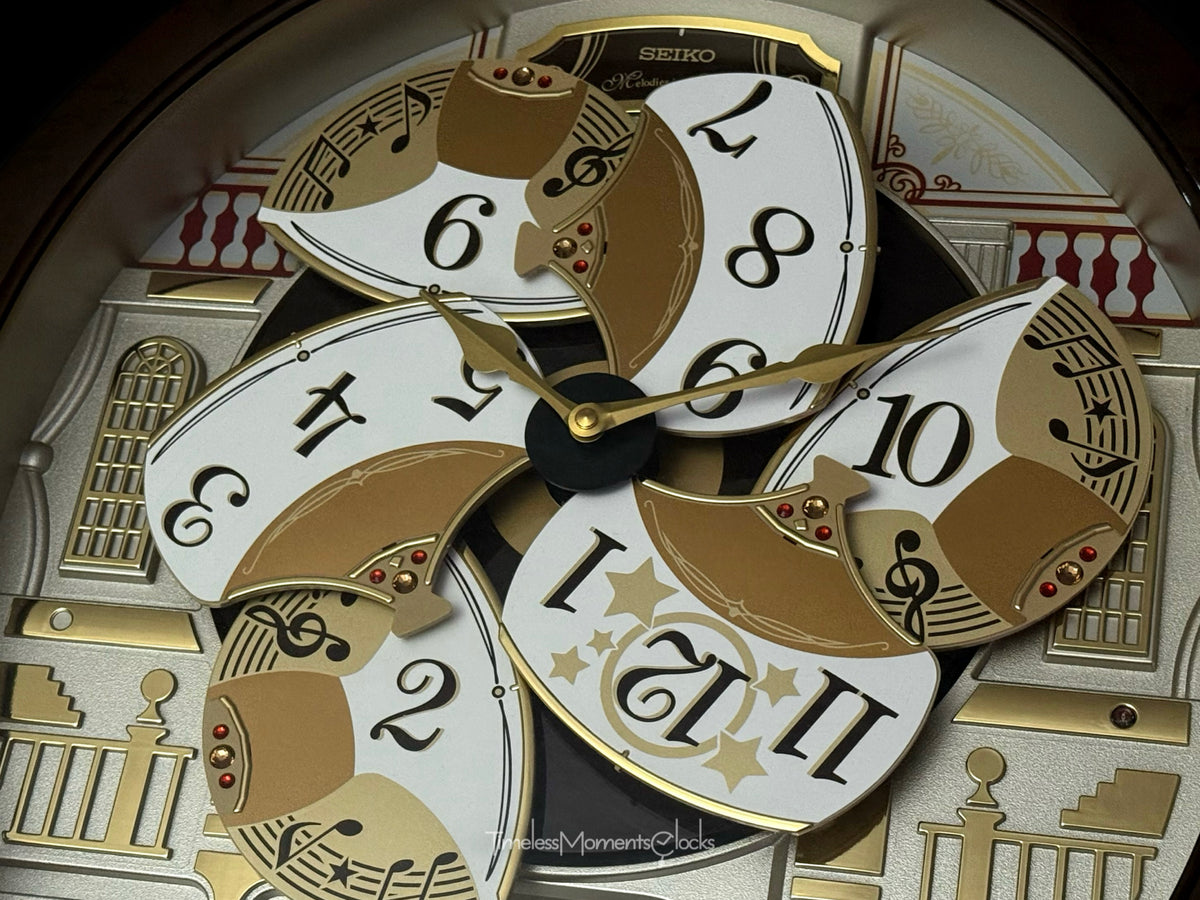 Seiko QXM607BRHZ “Concert Hall” Melodies in Motion Dancing Dial Musical Wall Clock with 45 Songs