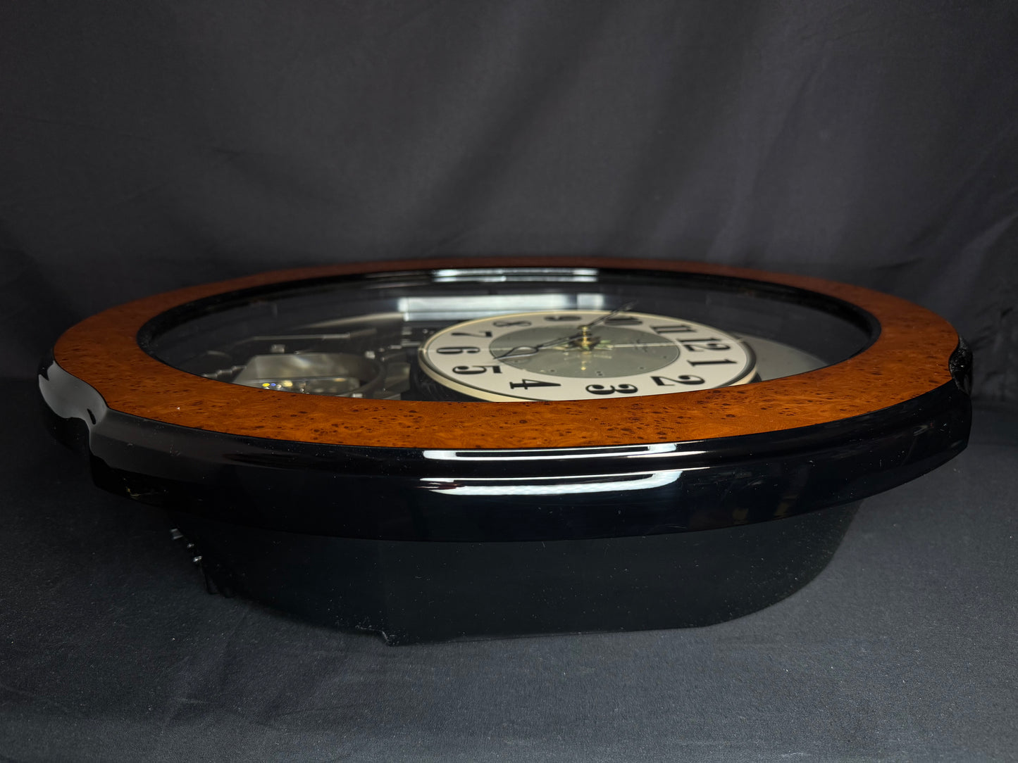 Rhythm “DWS Timecracker” Moving Dial Magic Motion Musical Wooden Wall Clock with Popular Melodies - 4MH752-R06