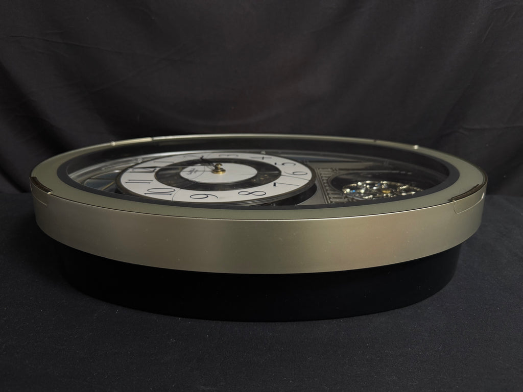 Rhythm "CTS Brilliance" Moving Dial Magic Motion Musical Wall Clock with Popular Melodies - 4MH787-R18