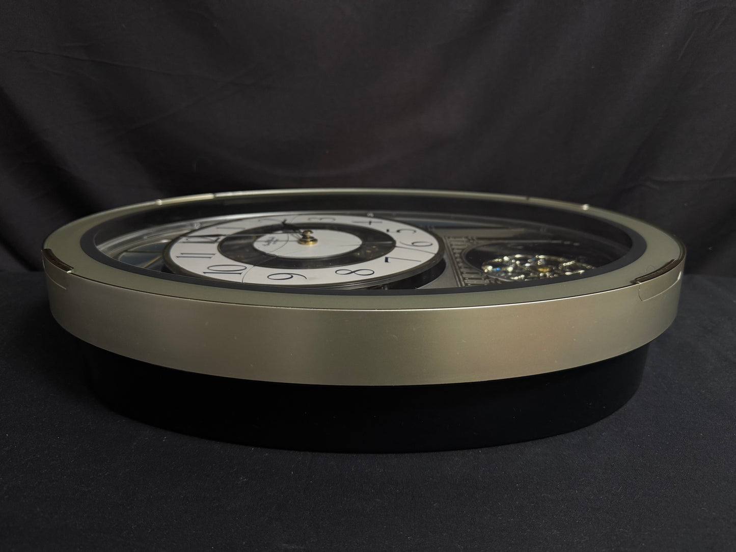 Rhythm "CTS Brilliance" Moving Dial Magic Motion Musical Wall Clock with Popular Melodies - 4MH787-R18