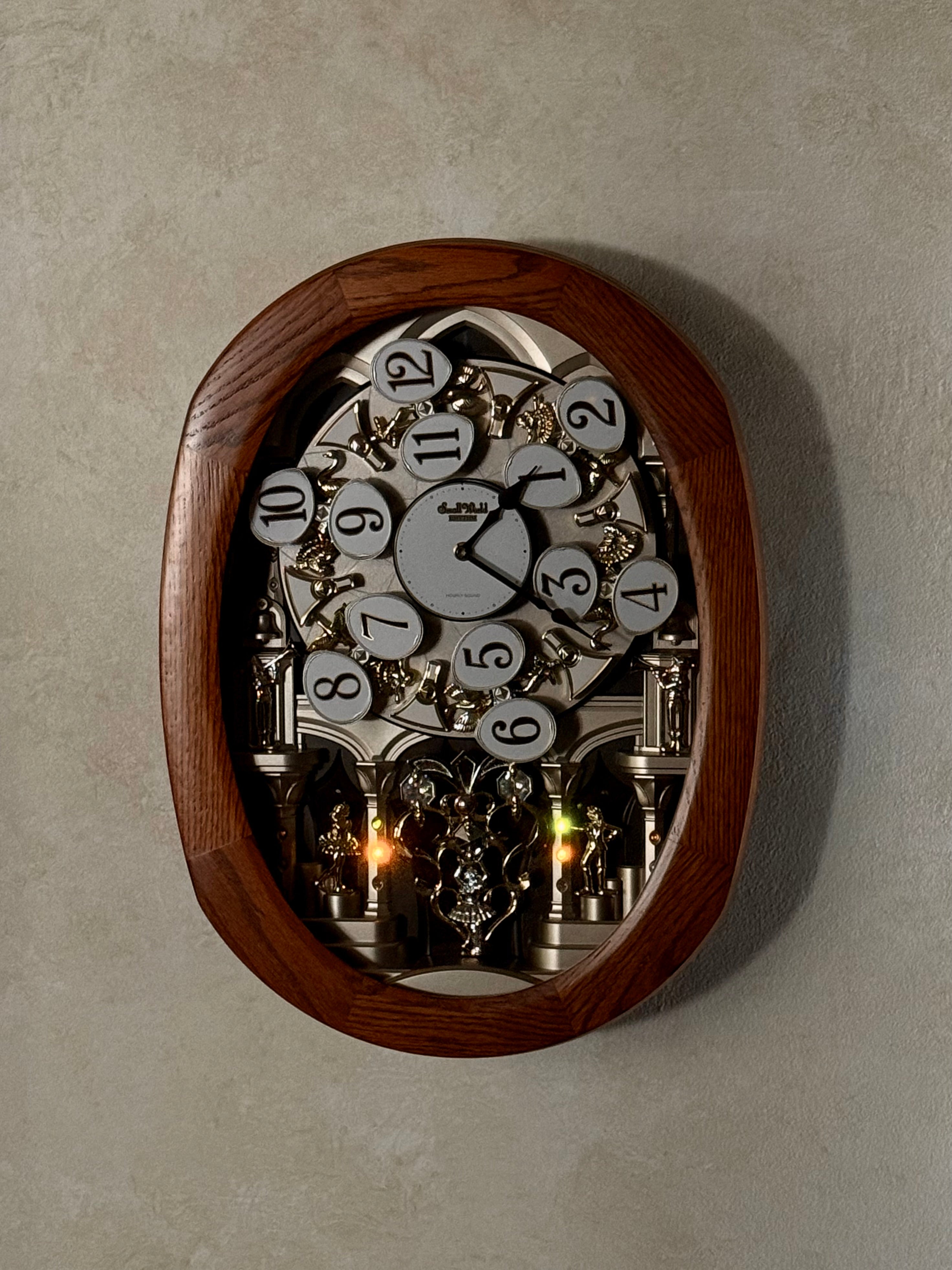 Rhythm "SSS Encore" Magic Motion Musical Wooden Wall Clock with Animated Moving Dial and Popular Melodies - 4MH810-R06