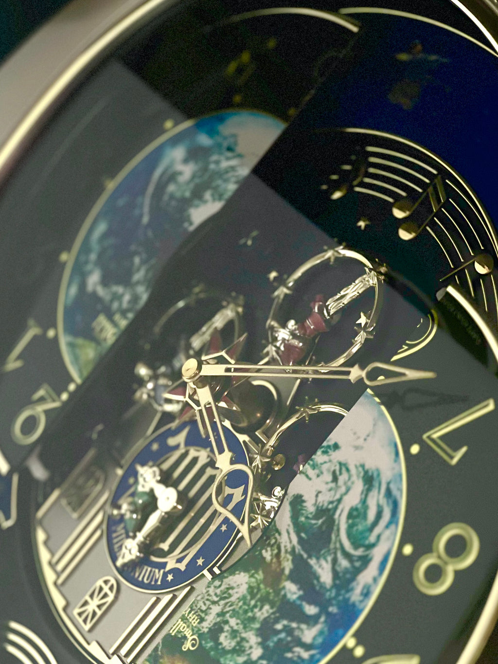 Rhythm “Timecracker 2000” Limited Edition Moving Earth Dial Magic Motion Musical Wall Clock with Popular Melodies - 4MH751NR19
