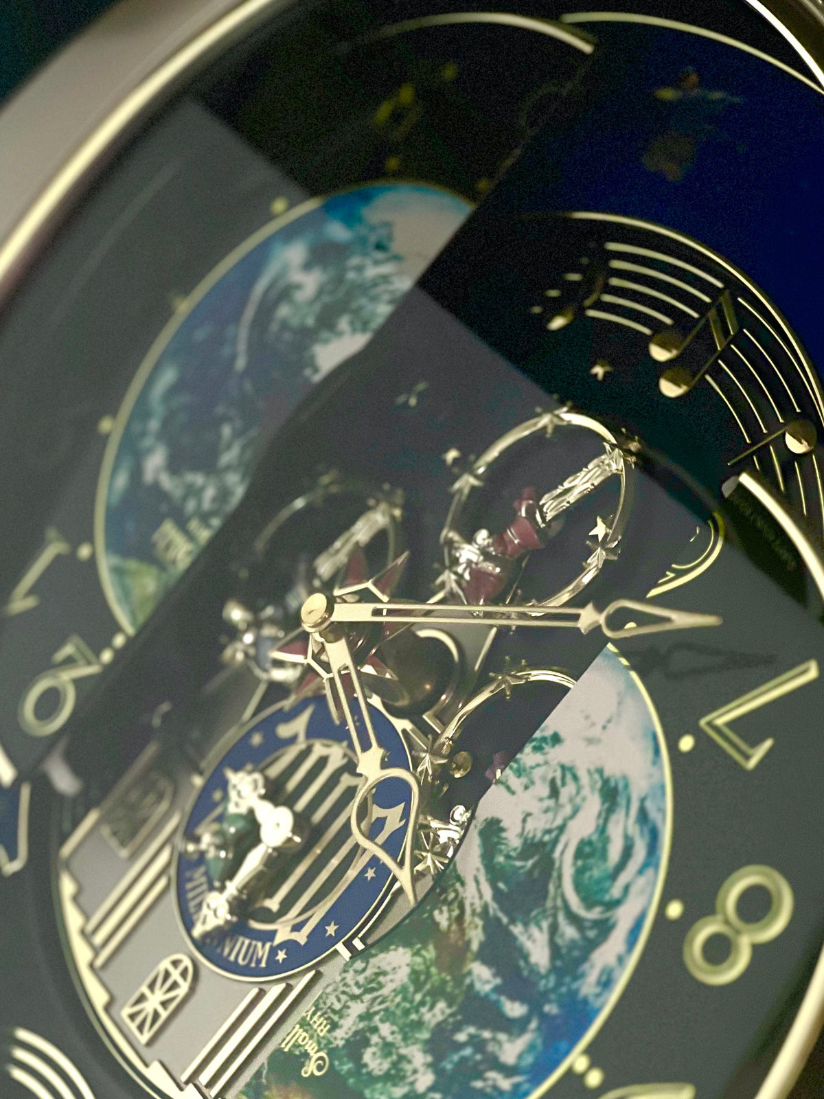 Rhythm “Timecracker 2000” Limited Edition Moving Earth Dial Magic Motion Musical Wall Clock with Popular Melodies - 4MH751NR19