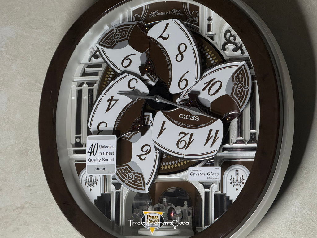 Seiko QXM615BRH “Snow Castle” Melodies in Motion Dancing Dial Musical Wall Clock with 40 Songs